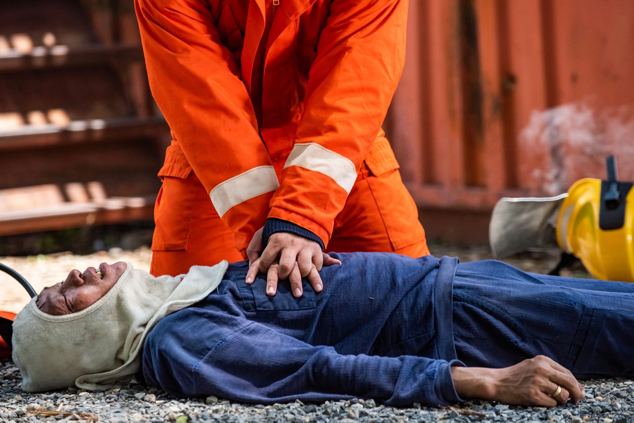 Responder performing CPR in an emergency scenario